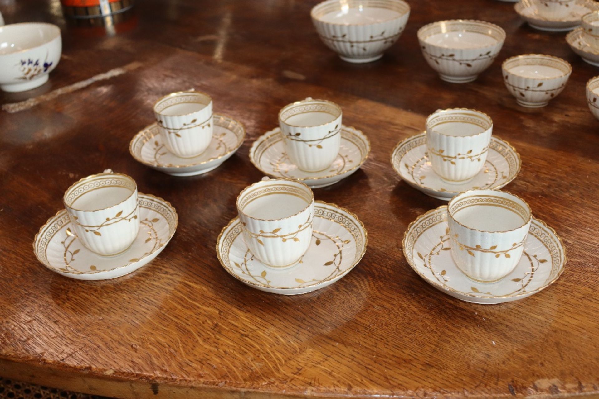 An early 19th Century English porcelain part tea set, of fluted design comprising numerous cups, - Image 3 of 32