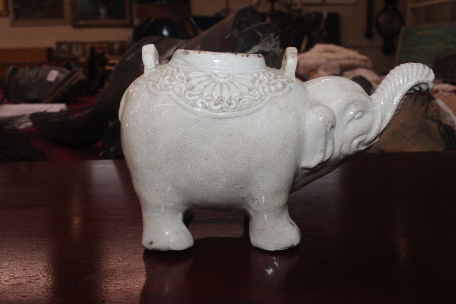 A Chinese blanc de chine water dropper in the form of an elephant, having moulded decoration to - Image 15 of 21