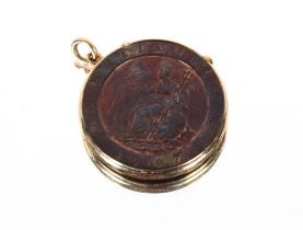 A circular vesta case, made from a George III cartwheel penny, mounted in gold
