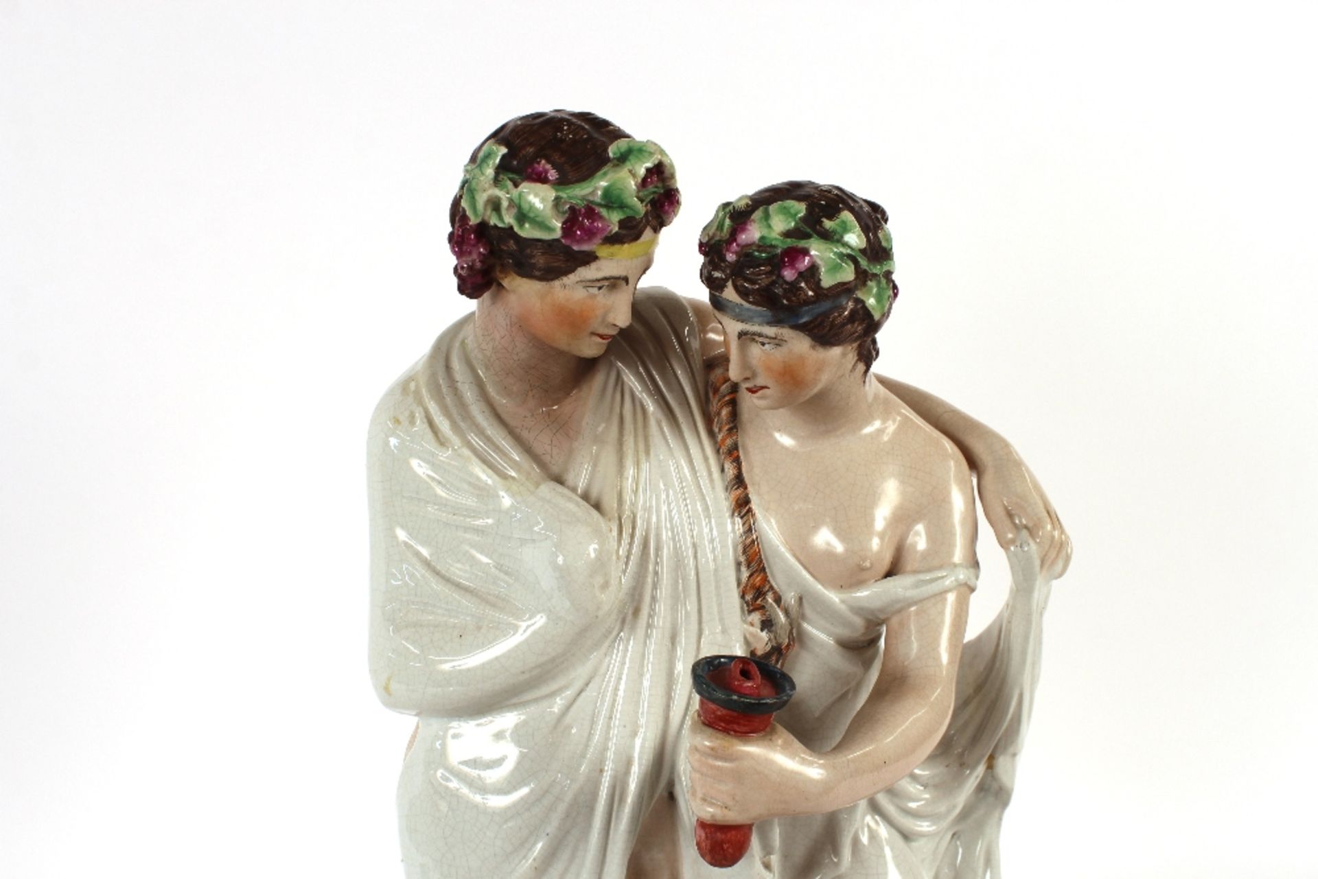 A large Staffordshire figure depicting a Bacchanalian couple, on plinth base, 64cm high - Image 2 of 4