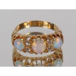 An opal and diamond ring, 18ct gold mount, 4.5gms