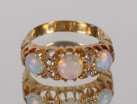 An opal and diamond ring, 18ct gold mount, 4.5gms