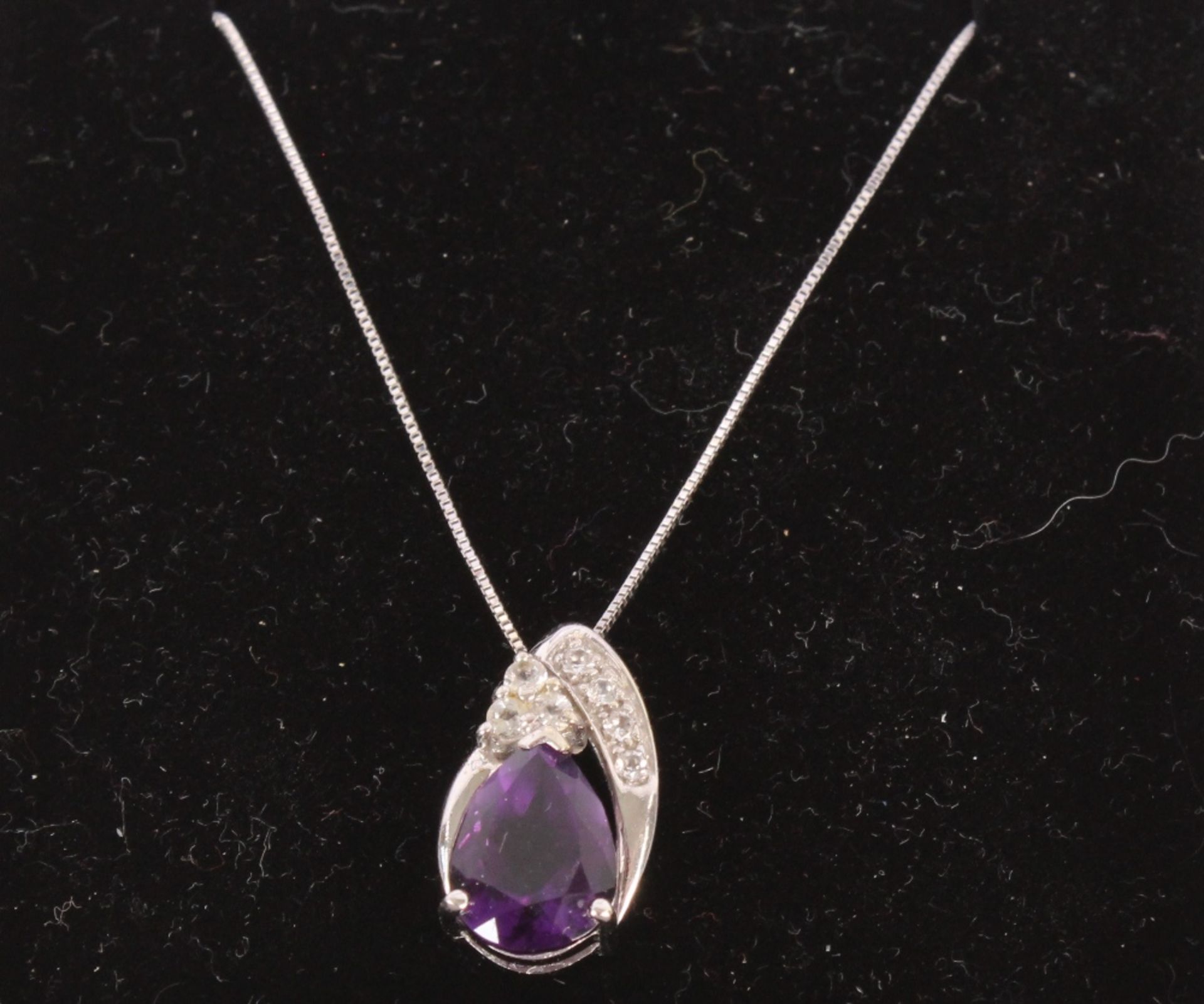 A 9ct white gold diamond and amethyst set necklace, hung to a fine link chain - Image 3 of 4