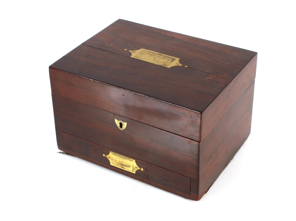 A 19th Century rosewood travelling toilet box, with sunken brass handles, 25.5cm wide x 16cm high
