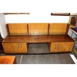 Desmond Ryan, a 1970's rosewood side cabinet fitted adjustable glass shelves and cupboards below,