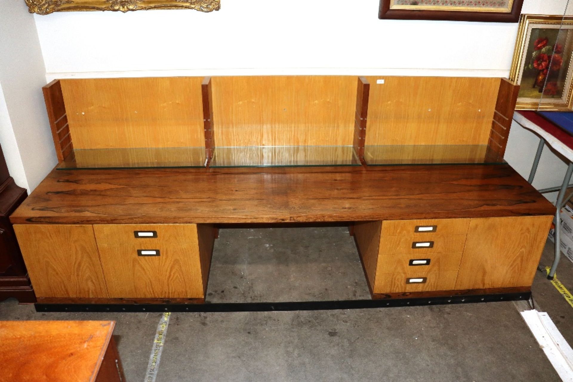 Desmond Ryan, a 1970's rosewood side cabinet fitted adjustable glass shelves and cupboards below,