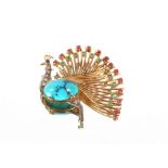 An impressive 18ct gold peacock brooch, set with diamonds, rubies, emeralds and sapphire around a