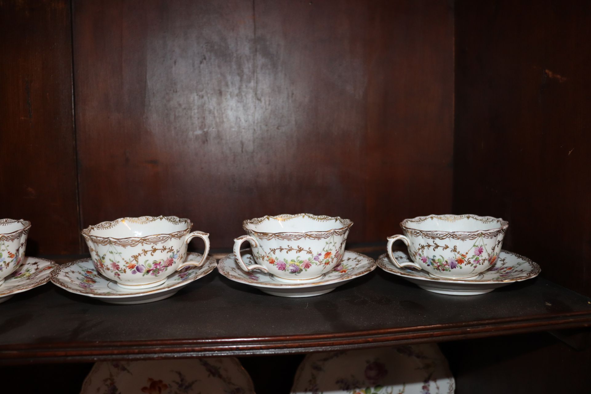 A Meissen part tea set, having painted foliate sprays heightened in gilt within shaped borders, - Image 8 of 9