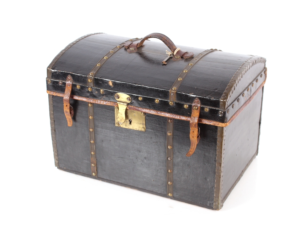 A domed leather and brass mounted travelling trunk, 46.5cm long