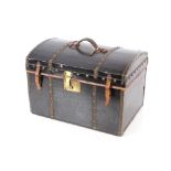 A domed leather and brass mounted travelling trunk, 46.5cm long