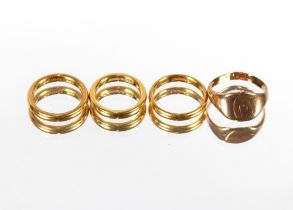 Three 22ct gold wedding bands, 16.7gms; and a 9ct