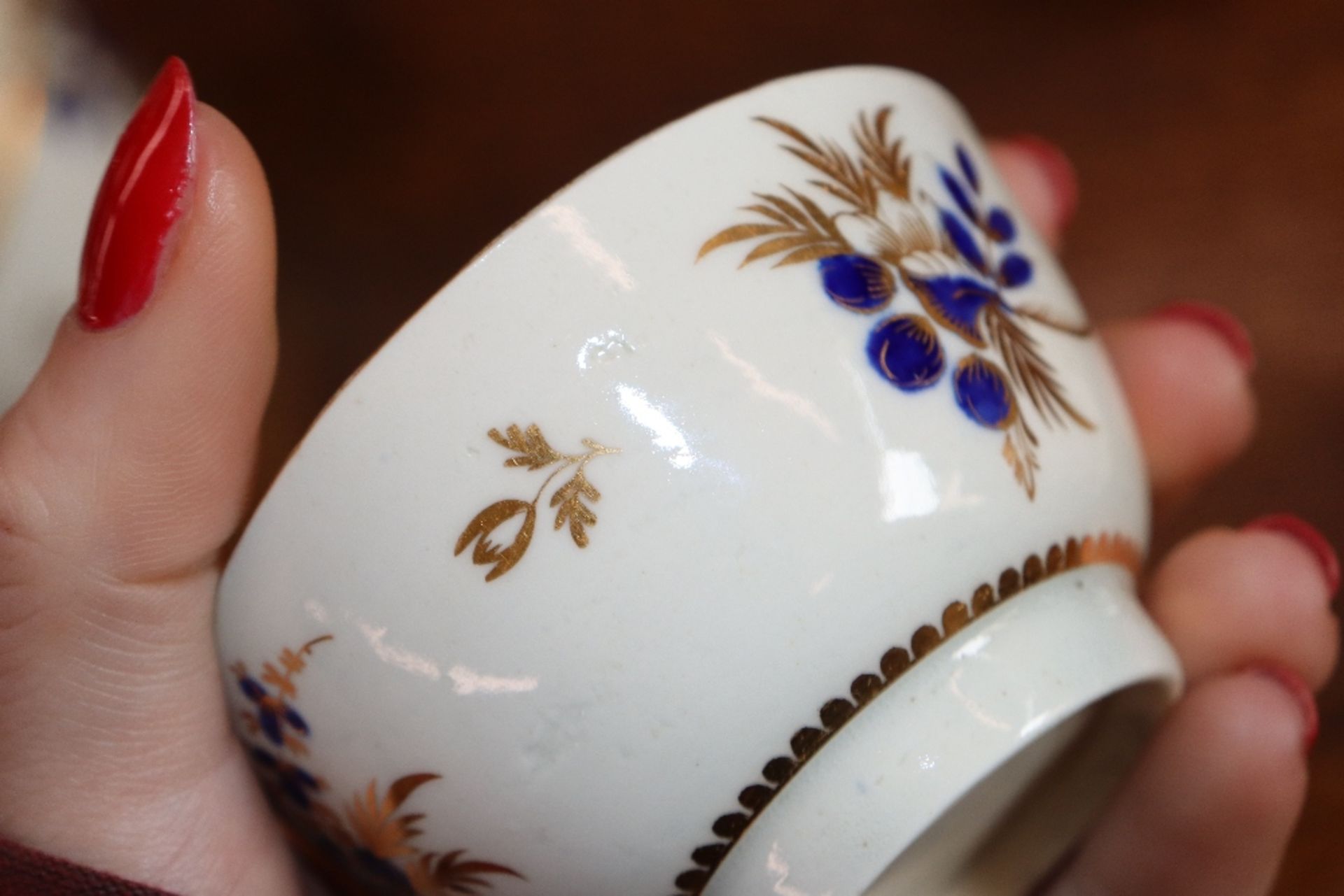 A 19th Century English porcelain part tea set having blue floral decoration heightened in gilt, - Image 6 of 33