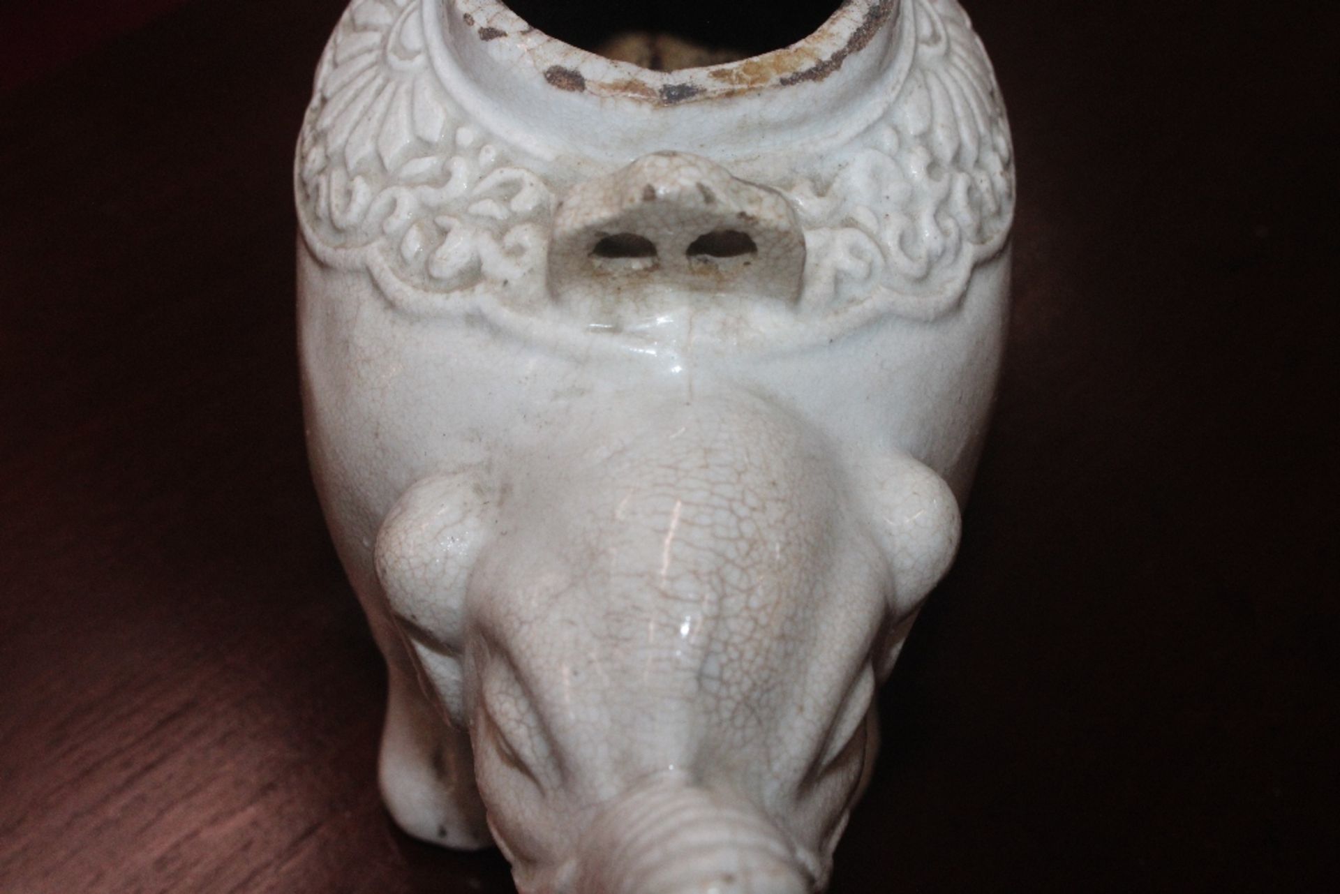A Chinese blanc de chine water dropper in the form of an elephant, having moulded decoration to - Image 7 of 21
