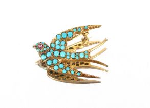 A 9ct gold turquoise and ruby set swallow brooch, 7.9gms