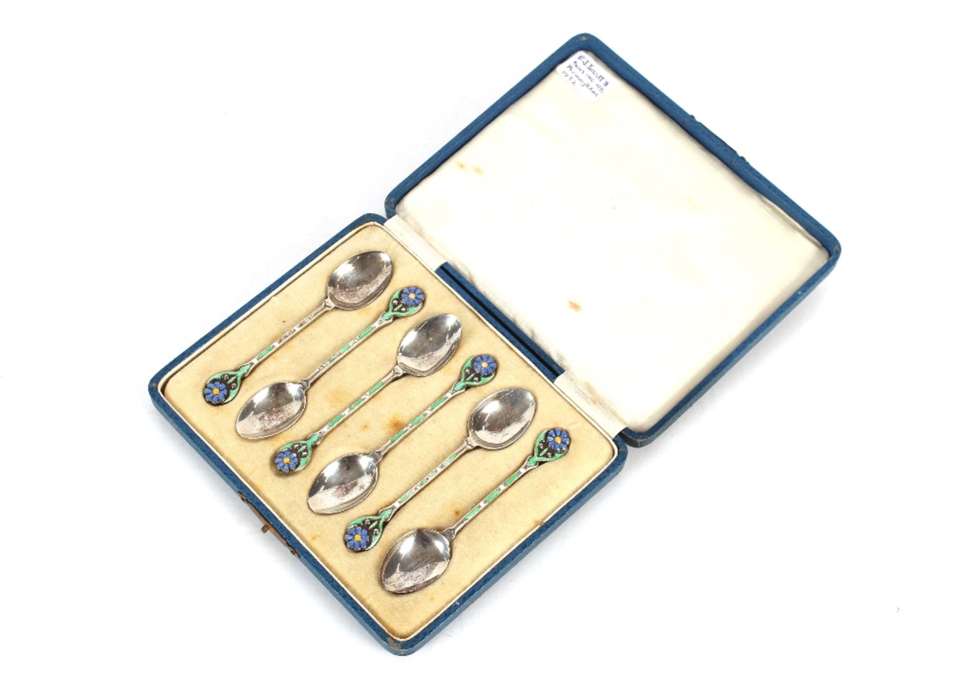A cased set of silver and enamel decorated teaspoons, by E.J. Trevit & Son, Birmingham 1932