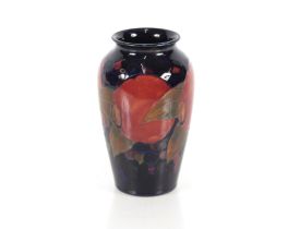 A William Moorcroft "Pomegranate" vase of baluster form, signature and impress mark to the base,