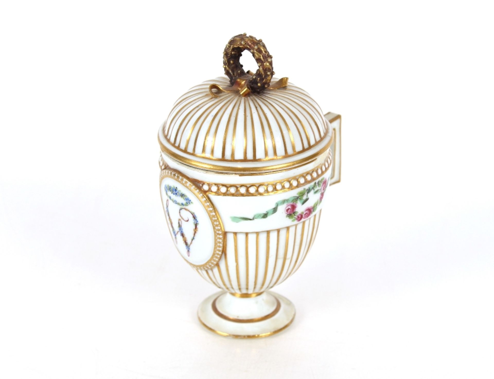 A Meissen chocolate cup and cover, possibly Marcolini period of ribbed baluster form, central