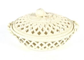 A 19th Century cream ware basket and cover with fruit finial, flanked by twist handles, 27cm long