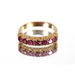 A 9ct gold ruby seven stone half eternity ring, 3g