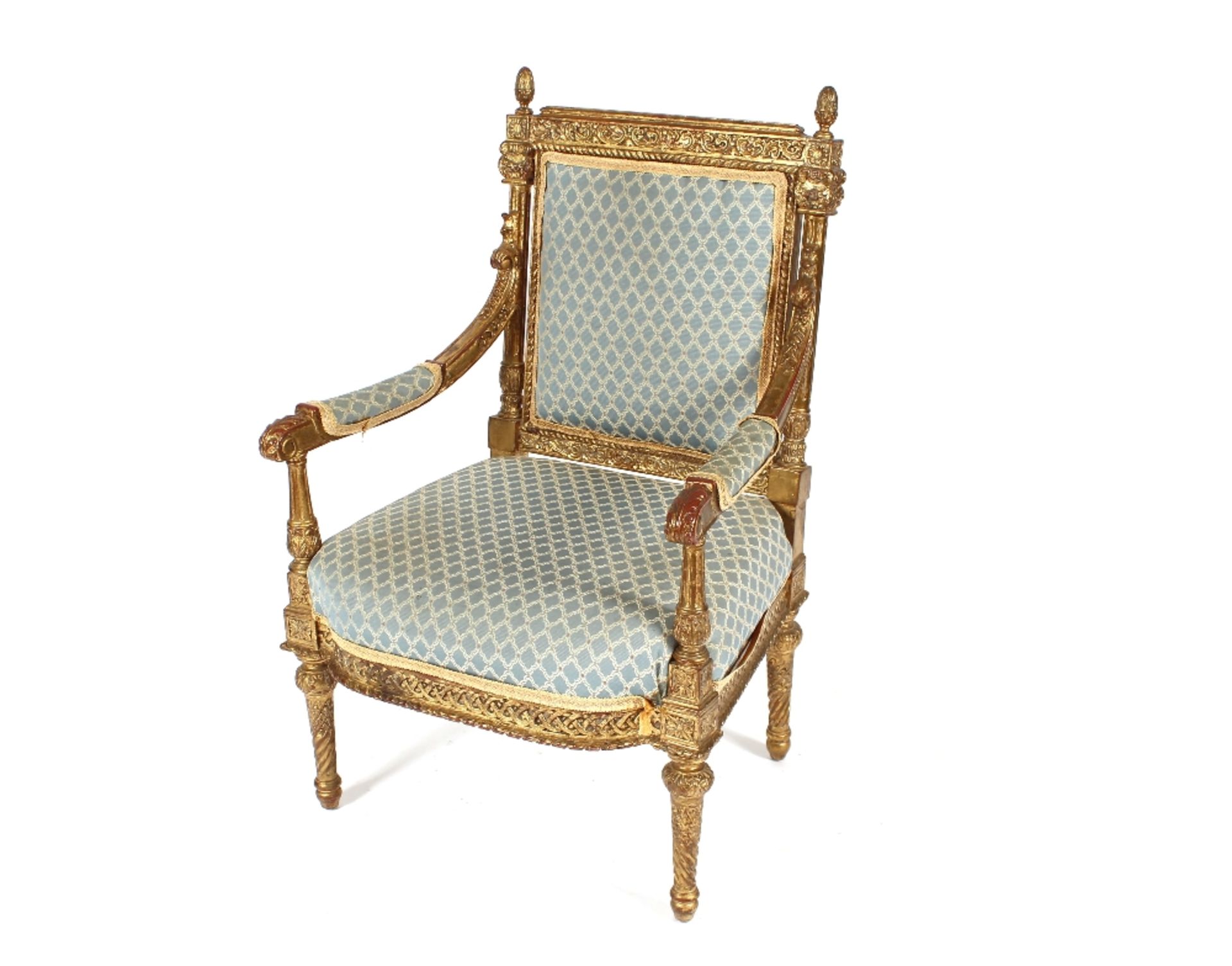 A pair of 19th Century French gilt wood armchairs, the back surmounted by pineapple finials above
