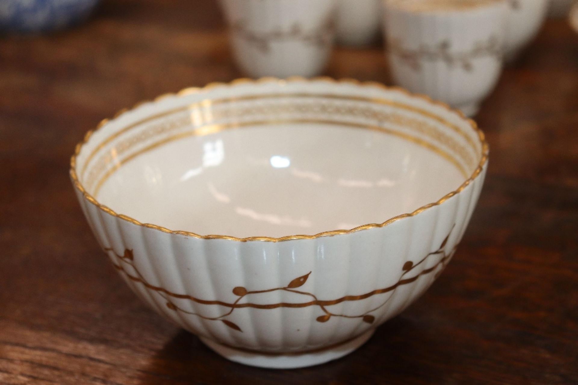 An early 19th Century English porcelain part tea set, of fluted design comprising numerous cups, - Image 19 of 32