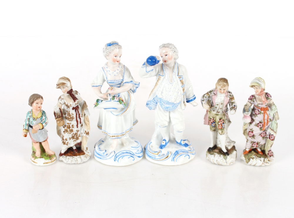 A Meissen style porcelain figure of a young boy; three German porcelain figures of two maids and a