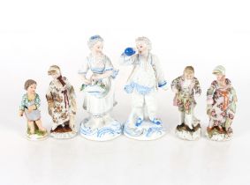 A Meissen style porcelain figure of a young boy; three German porcelain figures of two maids and a