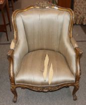 A Louis XV style gilt wood armchair having foliate