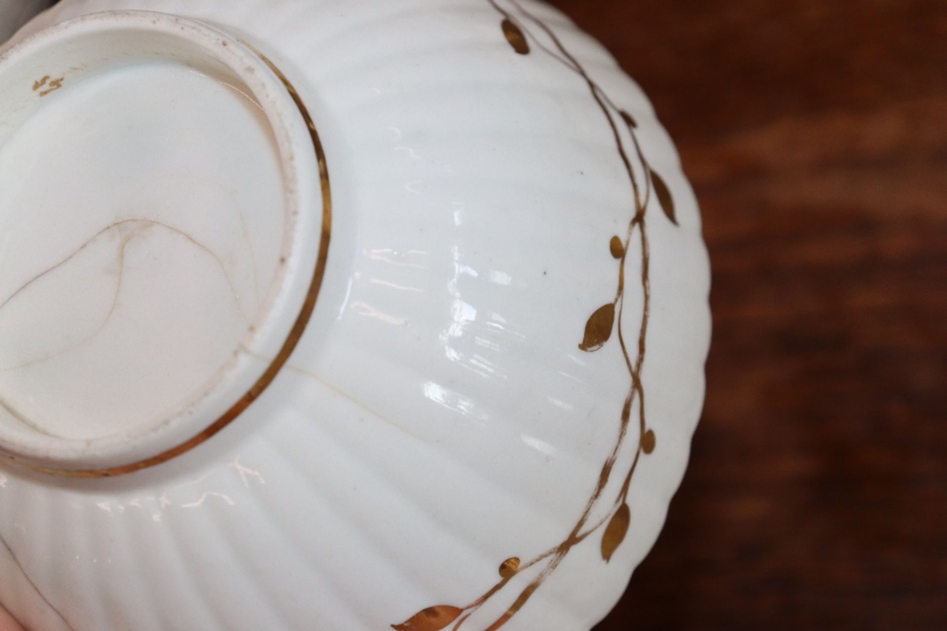 An early 19th Century English porcelain part tea set, of fluted design comprising numerous cups, - Image 18 of 32