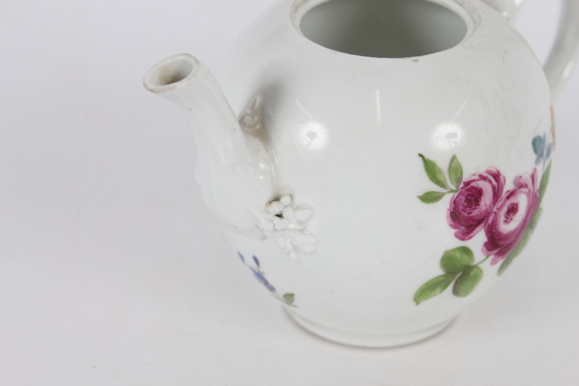 A 19th Century Meissen bullet shaped tea pot, having foliate spray decoration, the lid with floral - Image 2 of 3