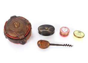 An oval horn snuff box, the lid inset with a faceted stone; a leather covered and bead decorated