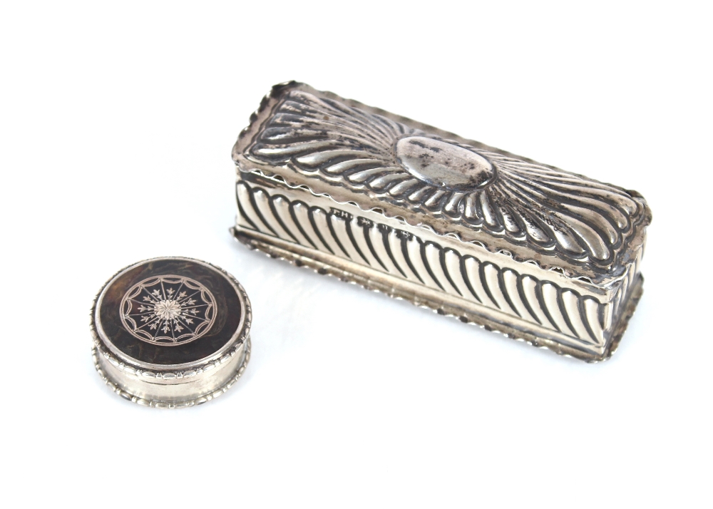 A small silver oblong pin box, with fluted decoration, Birmingham 1894; and a circular silver and