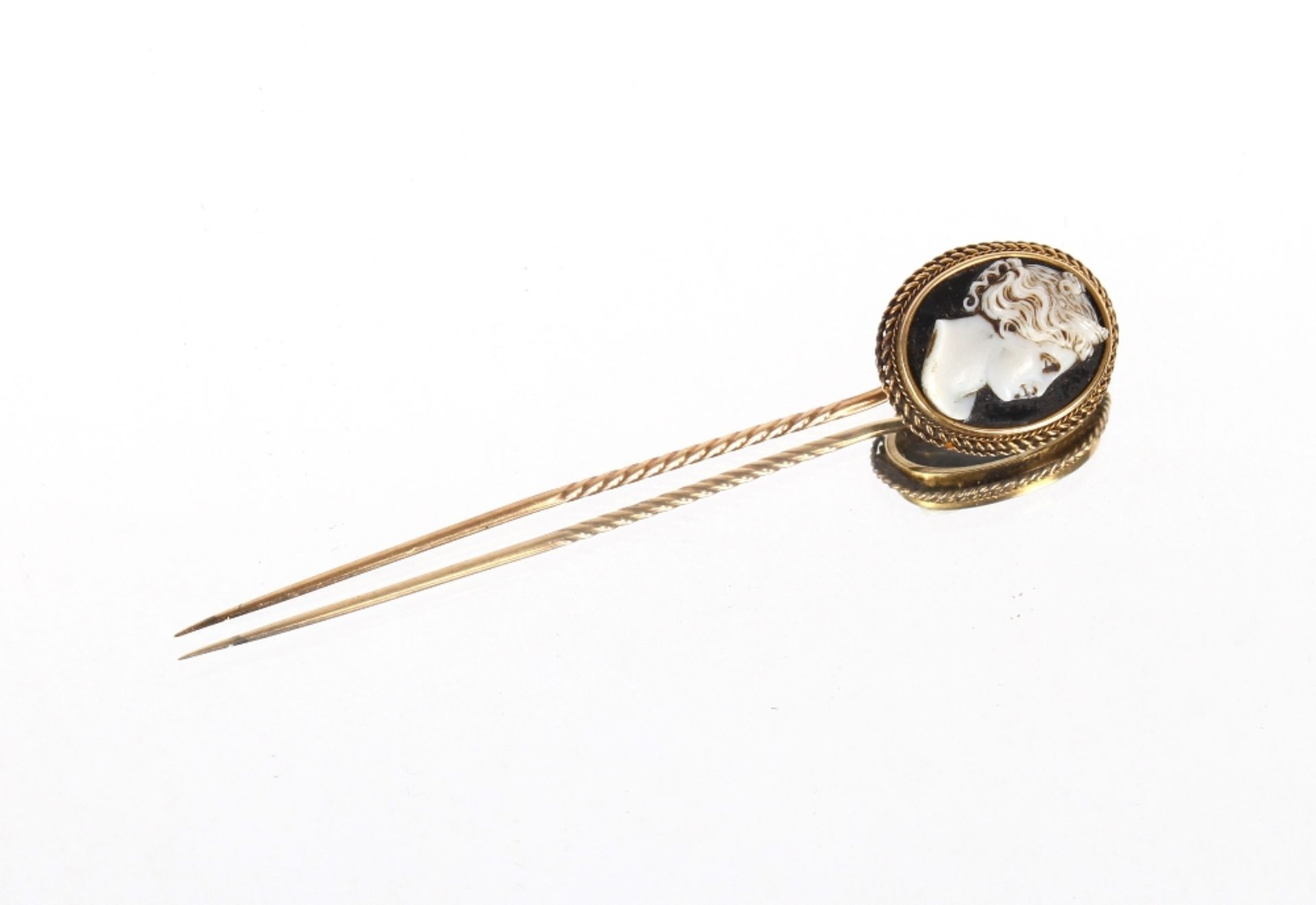 A cased gold stick pin with cameo set terminal