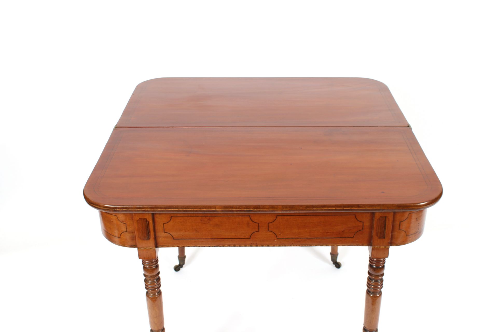 A 19th Century mahogany and ebony strung fold over card table raised on ring turned tapering - Image 2 of 3