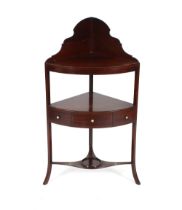 A 19th Century mahogany corner washstand, fitted single drawer raised on out swept supports,
