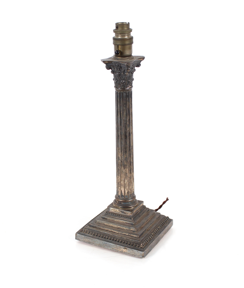 A silver Corinthian column candlestick, with presentation inscription presented to Captain E.R.C.