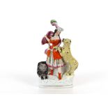 A 19th Century Staffordshire group depicting figure with lion and leopard, 35cm