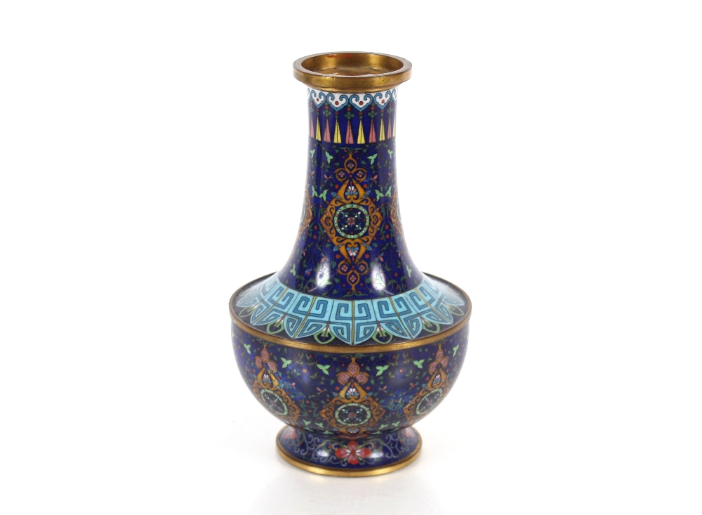A Chinese cloisonné baluster vase, having floral decoration and symbol banded border on blue ground,