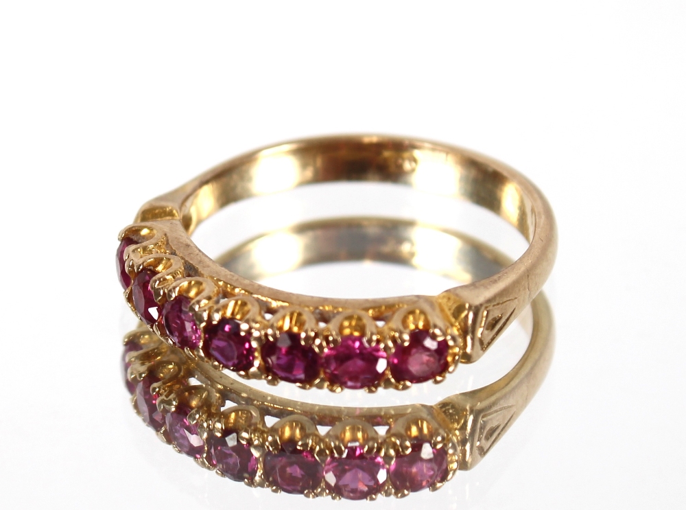 A 9ct gold ruby seven stone half eternity ring, 3g - Image 2 of 2