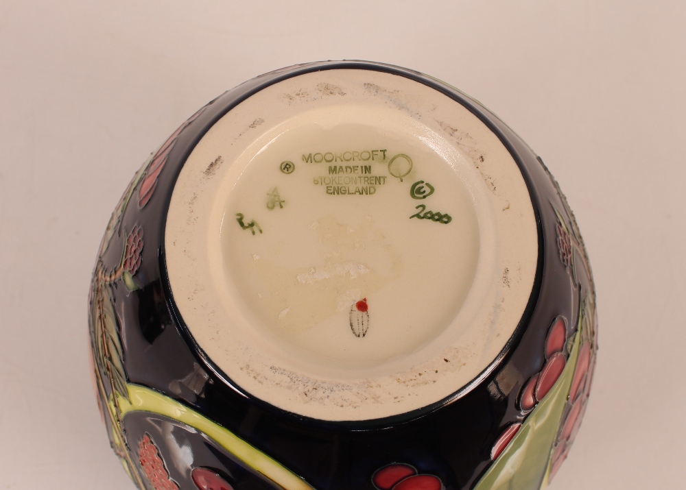 A Moorcroft fruit decorated jar and cover, 20cm high - Image 2 of 2