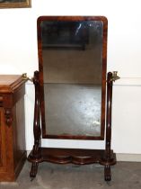 A 19th Century mahogany cheval mirror, the oblong plate flanked by brass adjustable candle sconces