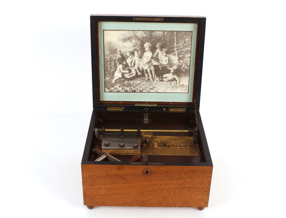 A Symphonion table model polyphon, in walnut case inscribed "Note Tune Plaque No. 48" and a