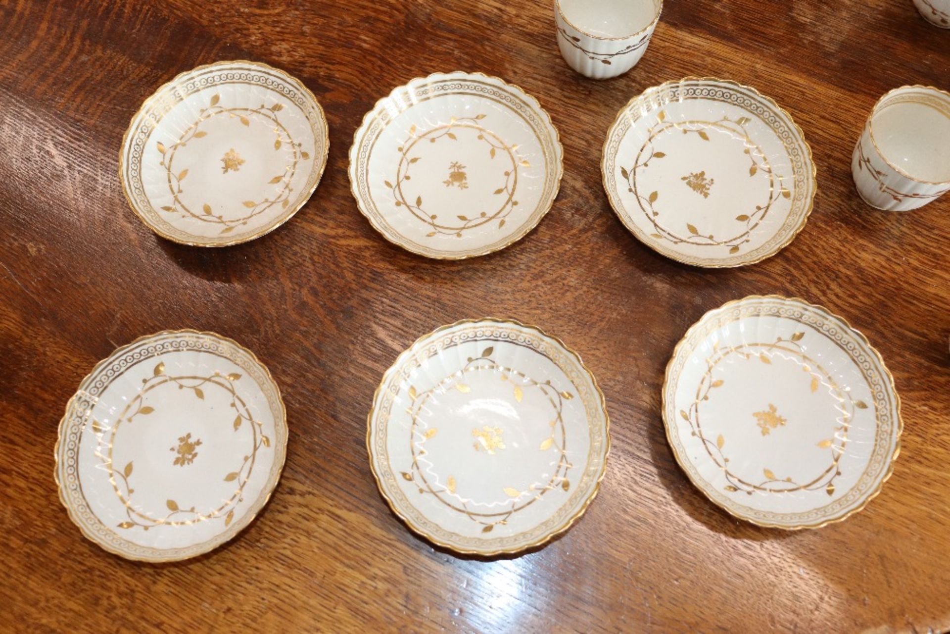 An early 19th Century English porcelain part tea set, of fluted design comprising numerous cups, - Image 8 of 32