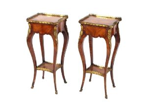 A pair of 19th Century French walnut and cross banded two tier side tables surmounted by pierced
