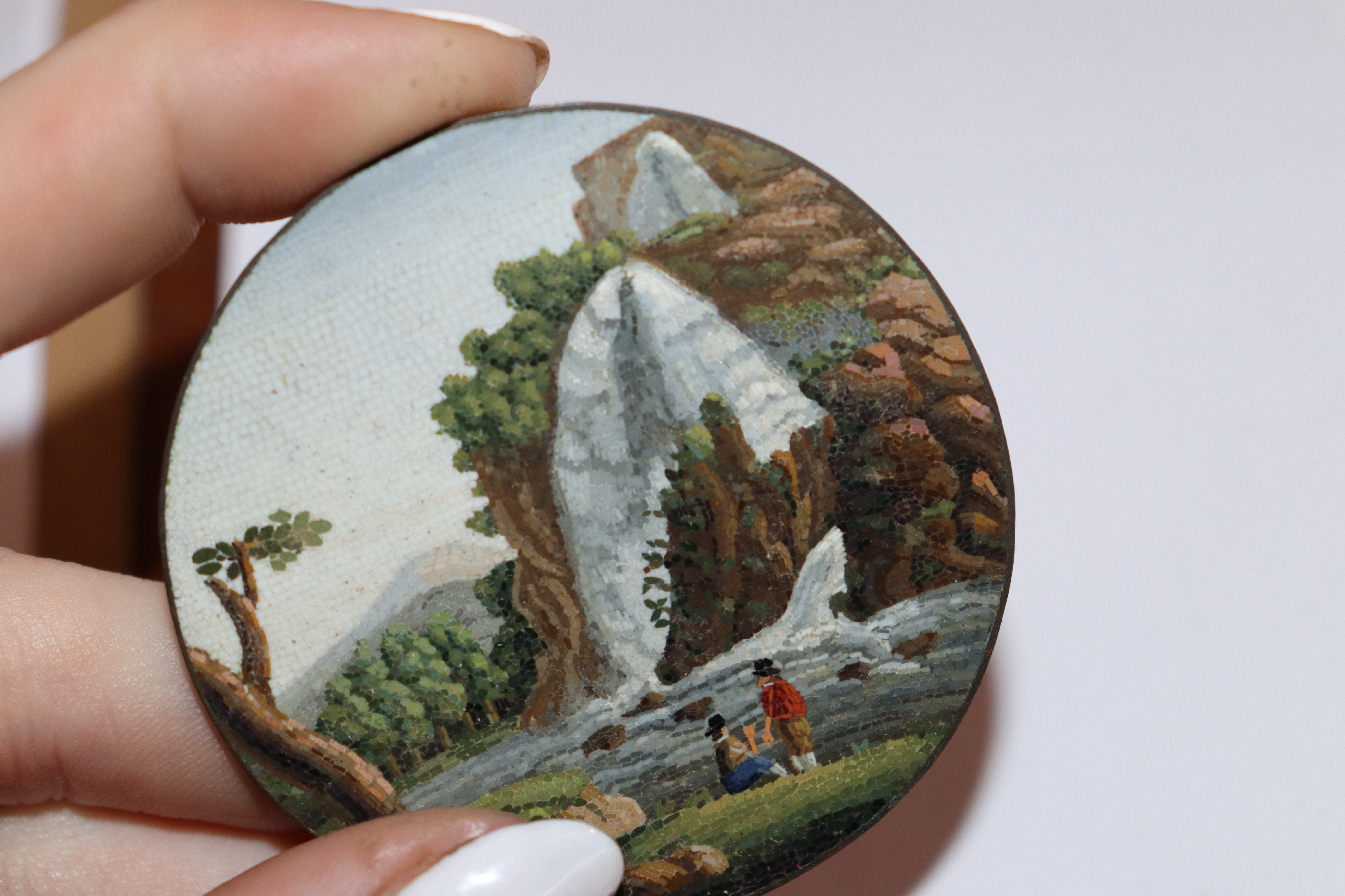 A miniature circular micro mosaic picture depicting figures in front of a waterfall; and a pair of - Image 11 of 11