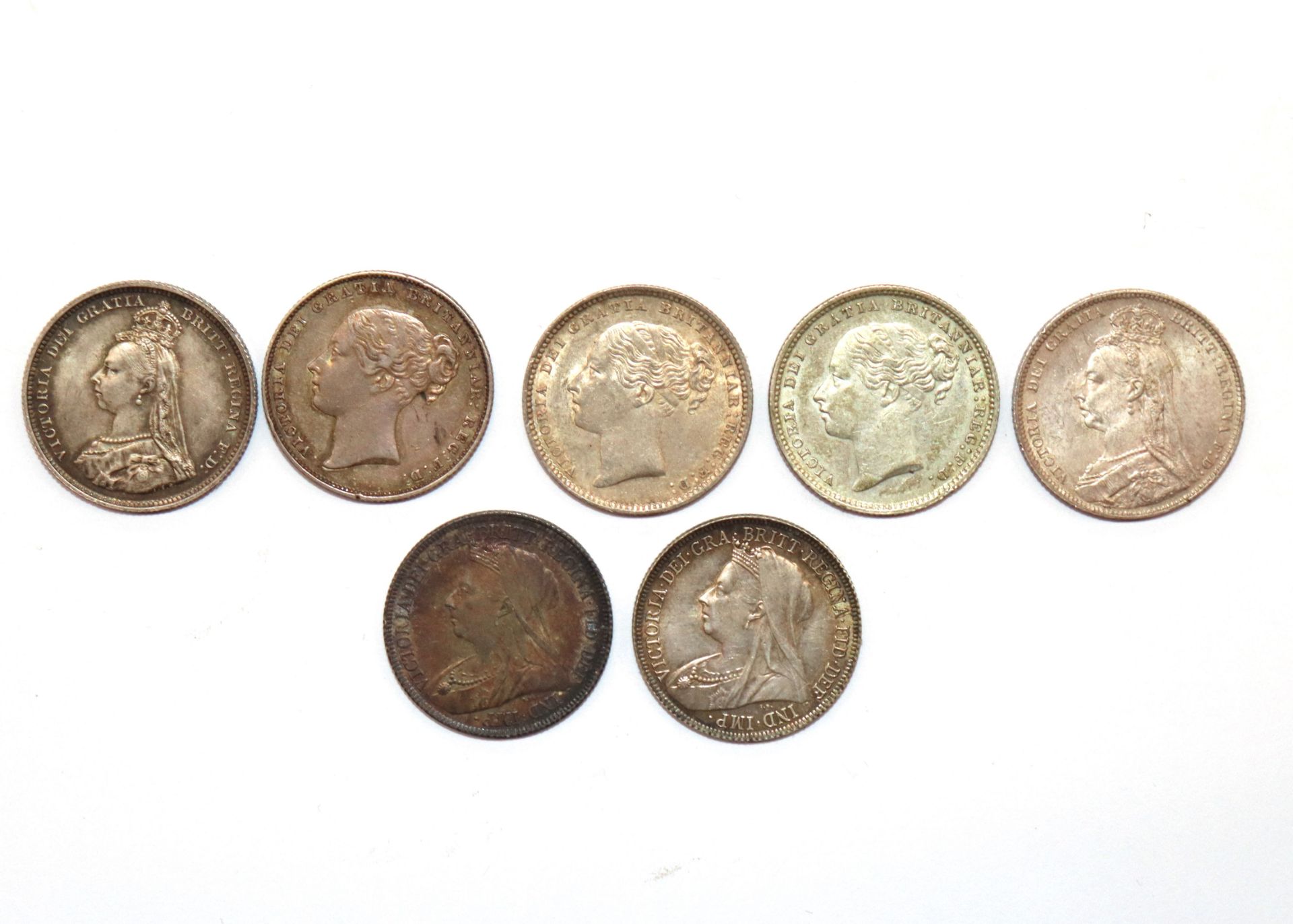 Seven Victorian shillings, ranging from 1867-1900 - Image 2 of 3