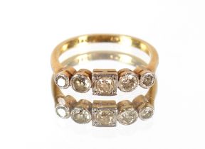 An 18ct gold and platinum ring set five diamonds,