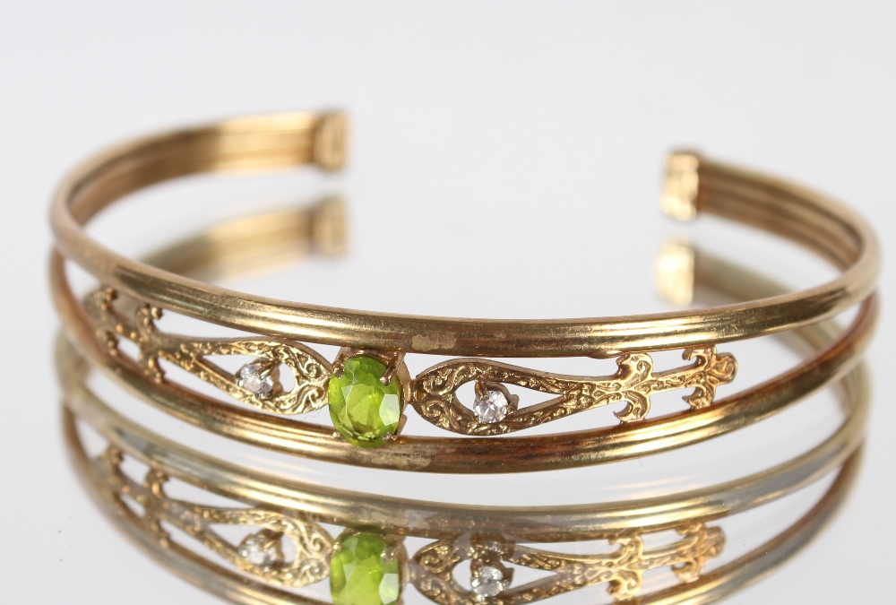 A 9ct gold peridot and white stone bangle, 10.7gms - Image 6 of 6