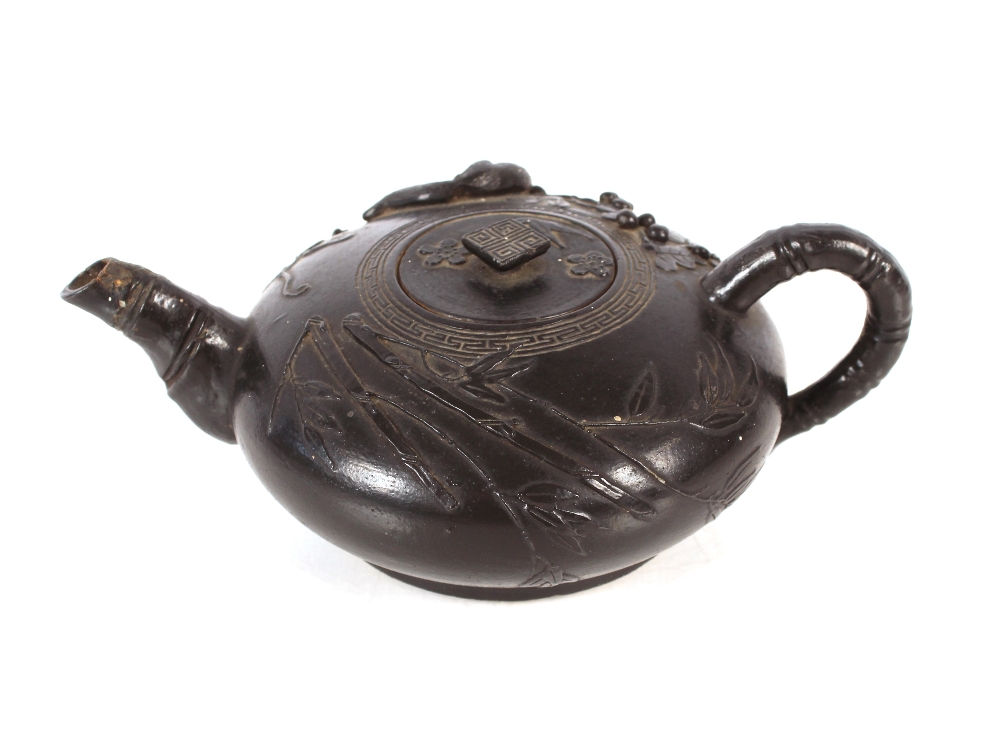 A Chinese black glazed teapot of squat form with raised animal and berry decoration, leaf shaped - Image 2 of 20