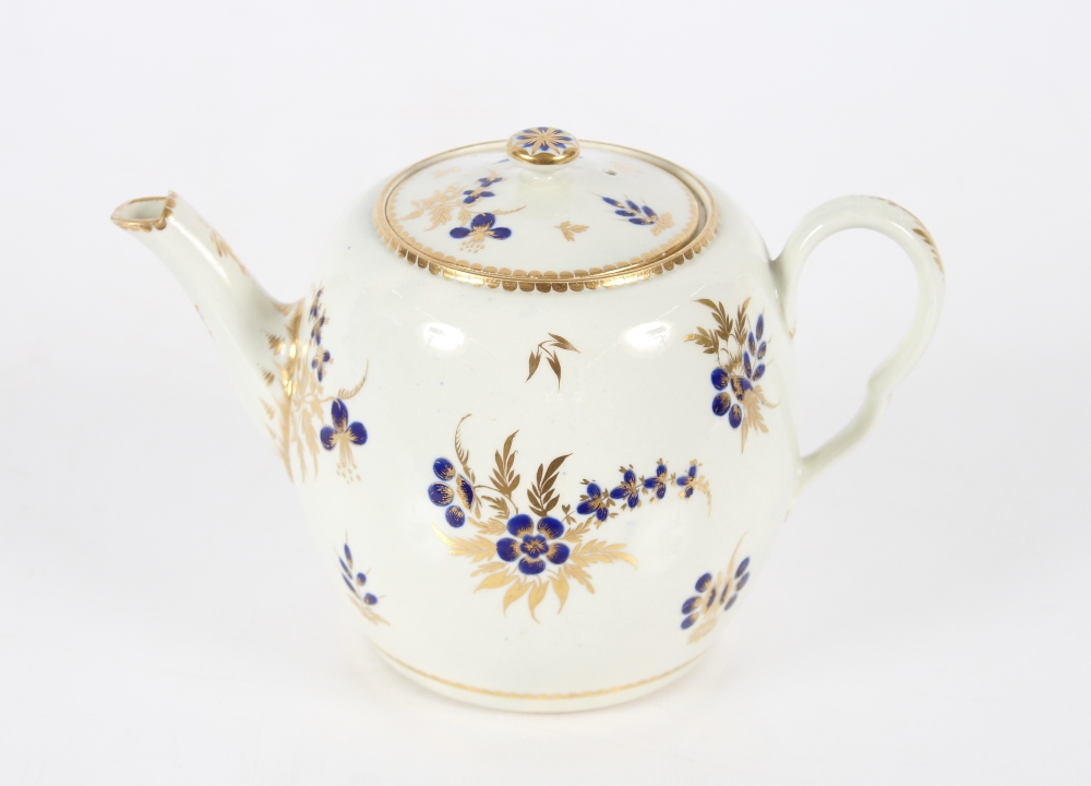 A 19th Century English porcelain part tea set having blue floral decoration heightened in gilt,
